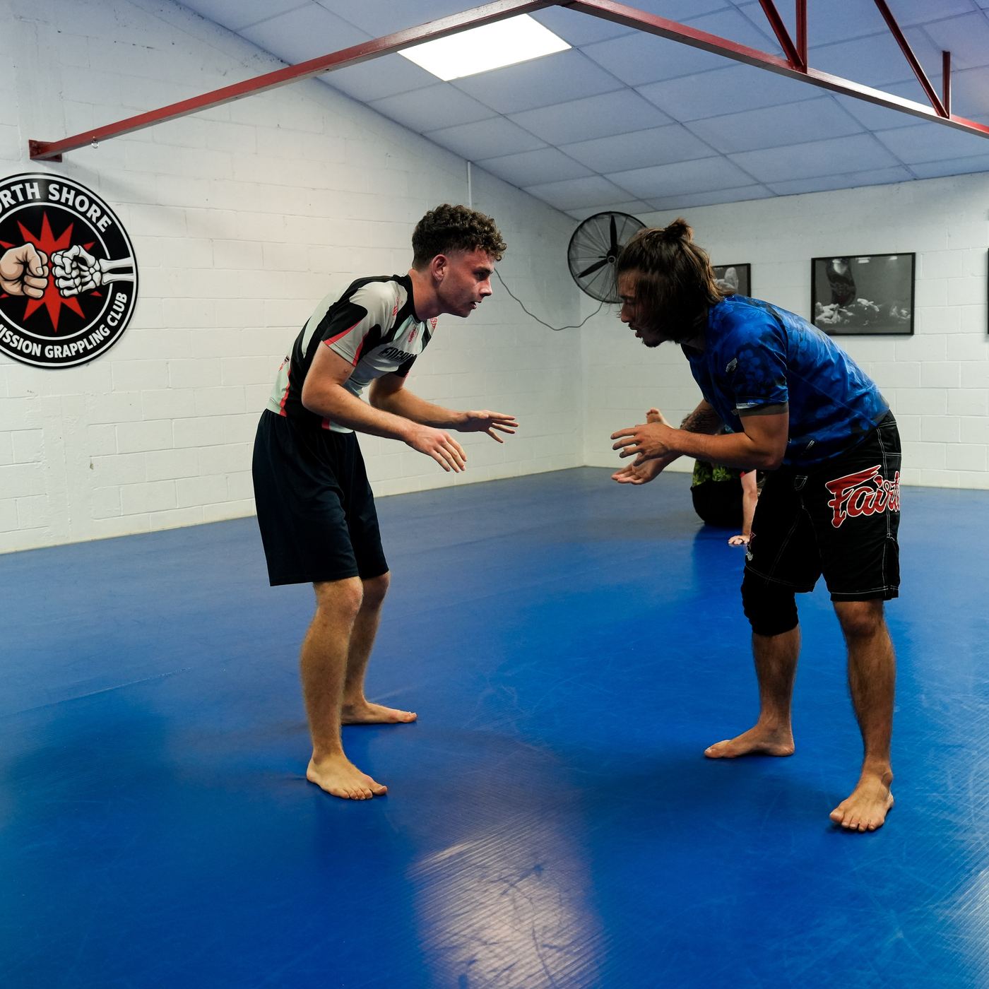 Two athletes squaring off during a grappling class at North Shore Submission Grappling Club