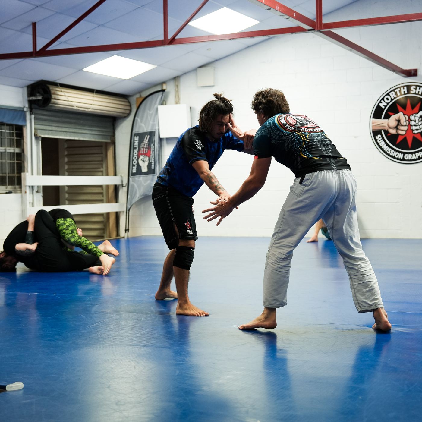 Grapplers hand fighting during class at North Shore Submission Grappling, Takapuna